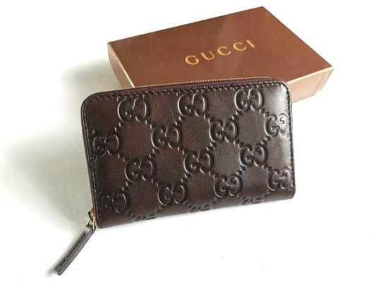 GUCCI Gucxissima brown leather zip around card case GG embossed